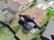 Aerial view of a home with a screened in patio and a fenced in backyard at 6157 Sequoia Dr, Port Orange, FL 32127