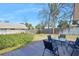 Backyard with a small wooden deck, table, and chairs at 6157 Sequoia Dr, Port Orange, FL 32127