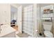 Bathroom featuring a shower with curtain, toilet, and sink with a view to the bedroom at 6157 Sequoia Dr, Port Orange, FL 32127