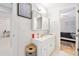 Bright bathroom featuring a vanity with storage, a mirror, and modern fixtures at 6157 Sequoia Dr, Port Orange, FL 32127