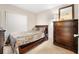 Cozy bedroom with a wood bed frame and a large dresser with a wooden mirror at 6157 Sequoia Dr, Port Orange, FL 32127