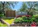 Riverwood Plantation's entrance includes a stone waterfall feature and colorful landscaping with lush greenery at 6157 Sequoia Dr, Port Orange, FL 32127
