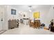 Well-lit dining area with tile floors, a painting and barstool seating at 6157 Sequoia Dr, Port Orange, FL 32127