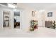 Bright foyer featuring tile floors, a decorative table, and doors to other rooms at 6157 Sequoia Dr, Port Orange, FL 32127
