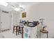 Kitchen bar area with seating, white cabinets, and counter work space at 6157 Sequoia Dr, Port Orange, FL 32127