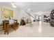 Bright, open living room featuring a distinctive spiral staircase and tiled floors at 6157 Sequoia Dr, Port Orange, FL 32127