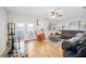Bright living room with a ceiling fan, sliding glass doors and plenty of windows at 6157 Sequoia Dr, Port Orange, FL 32127