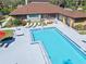 Overhead shot of neighborhood pool and pool house surrounded by well-maintained landscaping at 6157 Sequoia Dr, Port Orange, FL 32127