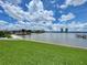 Spacious backyard with lush lawn and scenic views of the bay and pier at 625 N Halifax Ave # 15, Daytona Beach, FL 32118