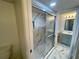 Beautifully renovated bathroom featuring glass shower, marble style floor and vanity at 625 N Halifax Ave # 15, Daytona Beach, FL 32118