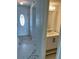 Bathroom with decorative mirror and a sink with a white cabinet at 625 N Halifax Ave # 15, Daytona Beach, FL 32118
