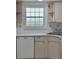 Bright kitchen features light wood cabinets, a stainless steel sink, and ample counter space for meal preparation at 625 N Halifax Ave # 15, Daytona Beach, FL 32118