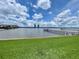 Beautiful water view showcasing clear blue skies, picturesque docks, and high-rise buildings in the distance, perfect for relaxation at 625 N Halifax Ave # 15, Daytona Beach, FL 32118