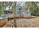 Backyard view featuring a deck, above ground pool, and exterior of the two story home at 749 E Wisconsin Ave, Orange City, FL 32763