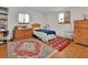 Bedroom with hardwood floors, vintage decor, and natural light from two windows at 749 E Wisconsin Ave, Orange City, FL 32763