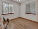 Bright room with faux wood flooring and lots of natural light from the large windows at 749 E Wisconsin Ave, Orange City, FL 32763