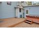 Back deck with a hot tub, a perfect setting for unwinding outdoors at 749 E Wisconsin Ave, Orange City, FL 32763