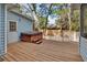 Outdoor deck showcasing a hot tub, ideal for relaxation and enjoyment at 749 E Wisconsin Ave, Orange City, FL 32763