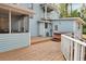 Exterior with porch, back deck and hot tub at 749 E Wisconsin Ave, Orange City, FL 32763