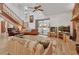 Living room with a staircase, sliding glass doors, and a vaulted ceiling at 749 E Wisconsin Ave, Orange City, FL 32763