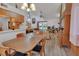 Open-concept living and dining area featuring wood-look floors and ample natural light at 749 E Wisconsin Ave, Orange City, FL 32763