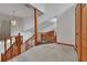 Loft space with wood railing, high ceilings, and view to the living room at 749 E Wisconsin Ave, Orange City, FL 32763