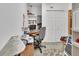 Office space with closet, shelving, desk, and floral rug at 749 E Wisconsin Ave, Orange City, FL 32763