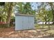 Exterior view of backyard shed with double doors, offering ample storage at 749 E Wisconsin Ave, Orange City, FL 32763