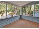 Comfortable sunroom space featuring screened windows at 749 E Wisconsin Ave, Orange City, FL 32763