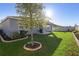 Picture of the backyard, showing the covered patio, lush grass, and new landscaping at 875 Honey Petal Ln, Deland, FL 32720