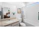 Bright bathroom showcasing tile floors, modern fixtures, and a tub with shower at 875 Honey Petal Ln, Deland, FL 32720