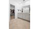 Bright bathroom featuring a double vanity with granite counters and a large walk-in closet at 875 Honey Petal Ln, Deland, FL 32720