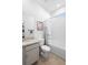 Bright bathroom showcasing tile floors, modern fixtures, and a tub with shower at 875 Honey Petal Ln, Deland, FL 32720