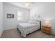 Comfortable bedroom with a cozy bed, carpeted floors and ceiling fan at 875 Honey Petal Ln, Deland, FL 32720