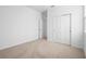 Neutral bedroom with carpet, white walls, a window and closet at 875 Honey Petal Ln, Deland, FL 32720
