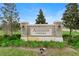 Addison Landing community entrance sign, set amidst lush green landscaping and mature trees at 875 Honey Petal Ln, Deland, FL 32720