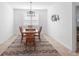 Charming dining room with stylish decor, wooden furniture, and neutral color palette at 875 Honey Petal Ln, Deland, FL 32720