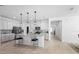 Bright and spacious kitchen featuring an island with seating, granite countertops, and stainless steel appliances at 875 Honey Petal Ln, Deland, FL 32720