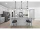 Modern kitchen featuring white cabinets, stainless steel appliances, granite countertops, and pendant lighting at 875 Honey Petal Ln, Deland, FL 32720
