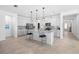 Modern kitchen featuring white cabinets, stainless steel appliances, granite countertops, and pendant lighting at 875 Honey Petal Ln, Deland, FL 32720