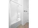 Bright white shower and tub combination with chrome fixtures and tiled walls at 875 Honey Petal Ln, Deland, FL 32720