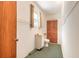 Small bathroom with a toilet, sink, and a window at 953 Pineapple Rd, South Daytona, FL 32119
