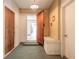 Inviting entryway with a bench and doorways leading to other rooms at 953 Pineapple Rd, South Daytona, FL 32119