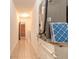 Functional hallway with tile flooring, HVAC system and laundry area, maximizing space and convenience at 953 Pineapple Rd, South Daytona, FL 32119