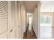 Hallway with hardwood floors leading to living room and pool area at 953 Pineapple Rd, South Daytona, FL 32119