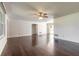 Large living room featuring hardwood floors and a neutral color scheme, creating a versatile living space at 953 Pineapple Rd, South Daytona, FL 32119
