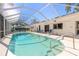 Beautiful backyard pool enclosed with a screened lanai and ample seating to enjoy the outdoor living space at 953 Pineapple Rd, South Daytona, FL 32119