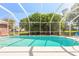 Refreshing pool enclosed with screen offering a private outdoor retreat, perfect for relaxation and entertainment at 953 Pineapple Rd, South Daytona, FL 32119