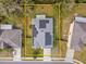 An aerial view showing a house with solar panels and an outlined yard at 971 Cascades Park Trl, Deland, FL 32720