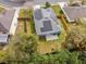 An aerial view of the property highlighting the solar panels and fenced backyard at 971 Cascades Park Trl, Deland, FL 32720